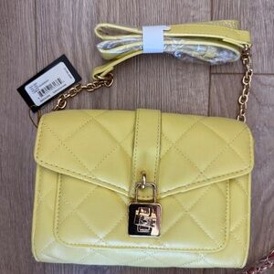Yellow crossbody purse  by badgley mischka.